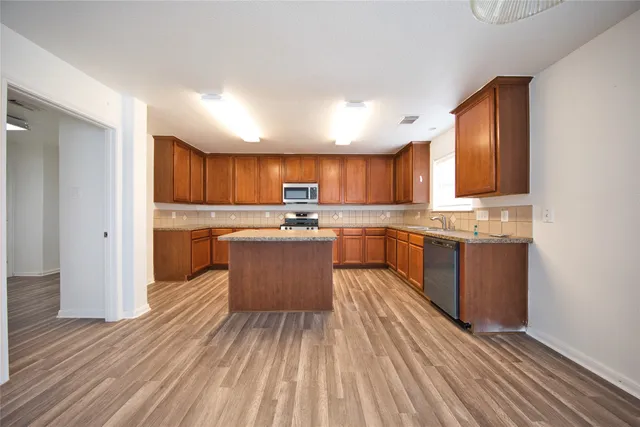 a large kitchen with cabinets