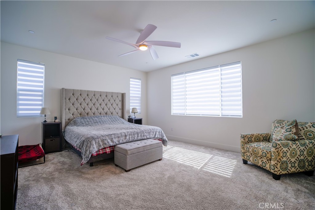 35323 Orchard Trail Fallbrook, CA 92028 - Photo 12 of 30 a spacious bedroom with a bed and a window