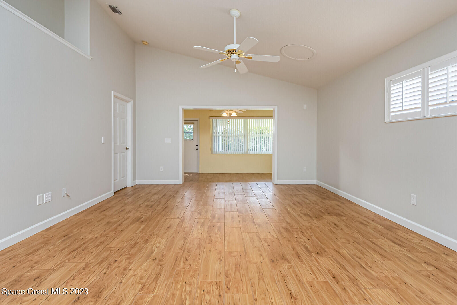 1041 South Fork Circle Melbourne, FL 32901 - Photo 15 of 62 wooden floor in an empty room with a window
