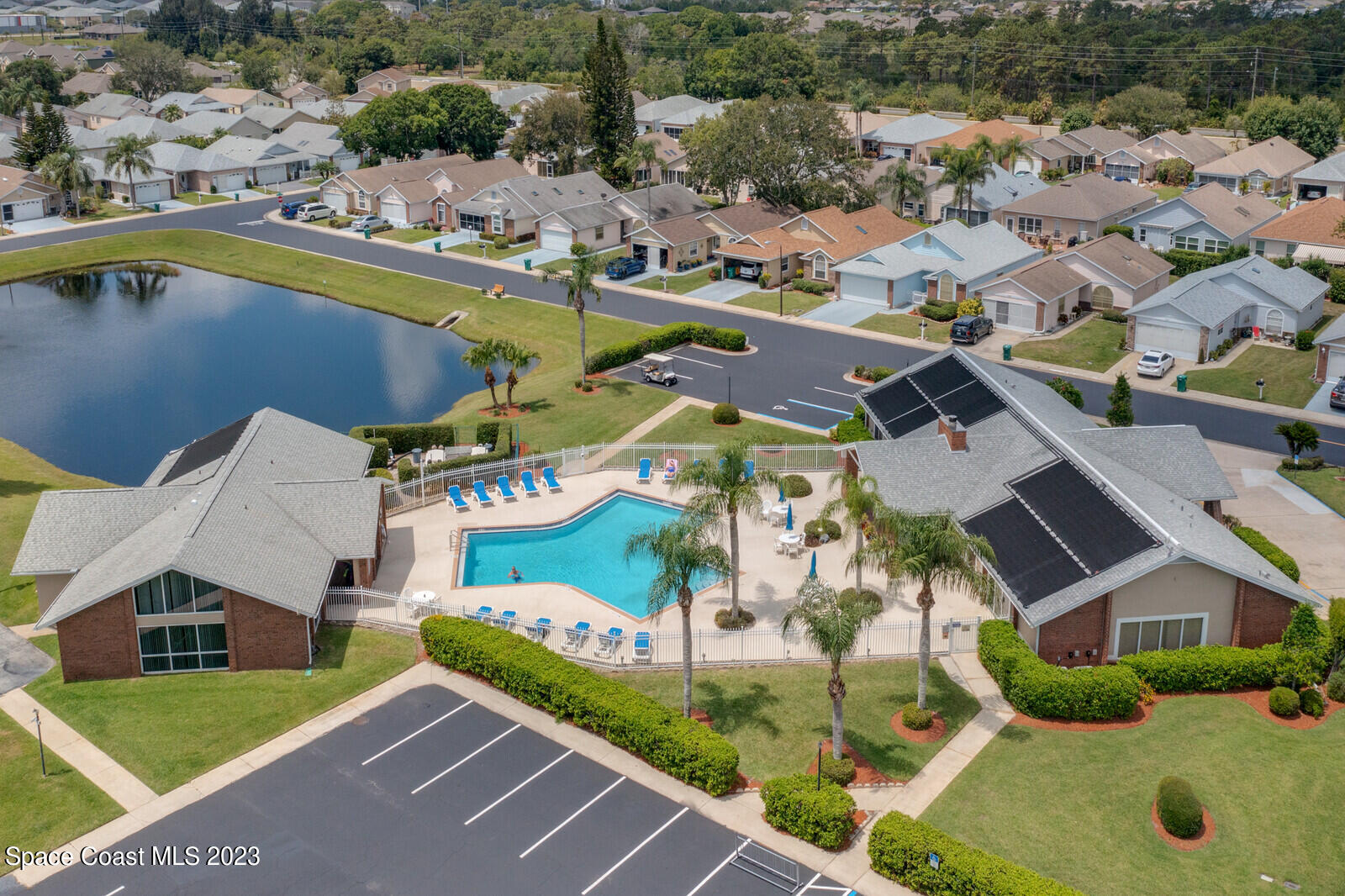 1041 South Fork Circle Melbourne, FL 32901 - Photo 3 of 62 an aerial view of residential houses with outdoor space and swimming pool