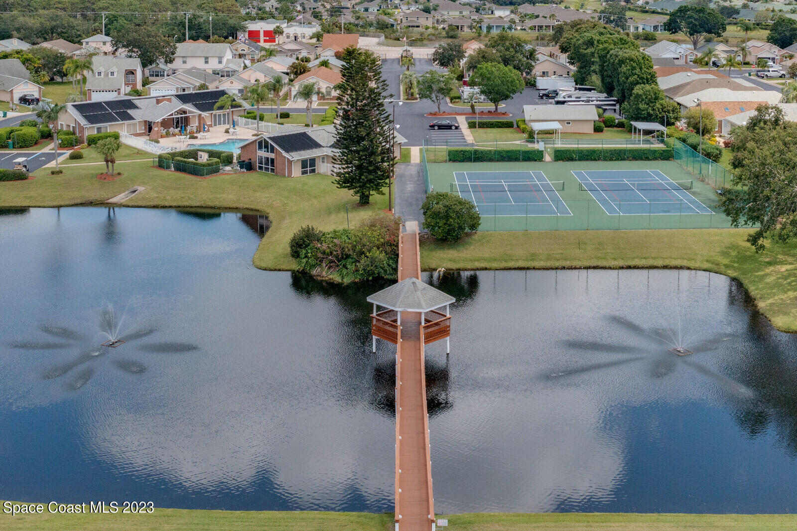 1041 South Fork Circle Melbourne, FL 32901 - Photo 34 of 62 a view of a lake with a house