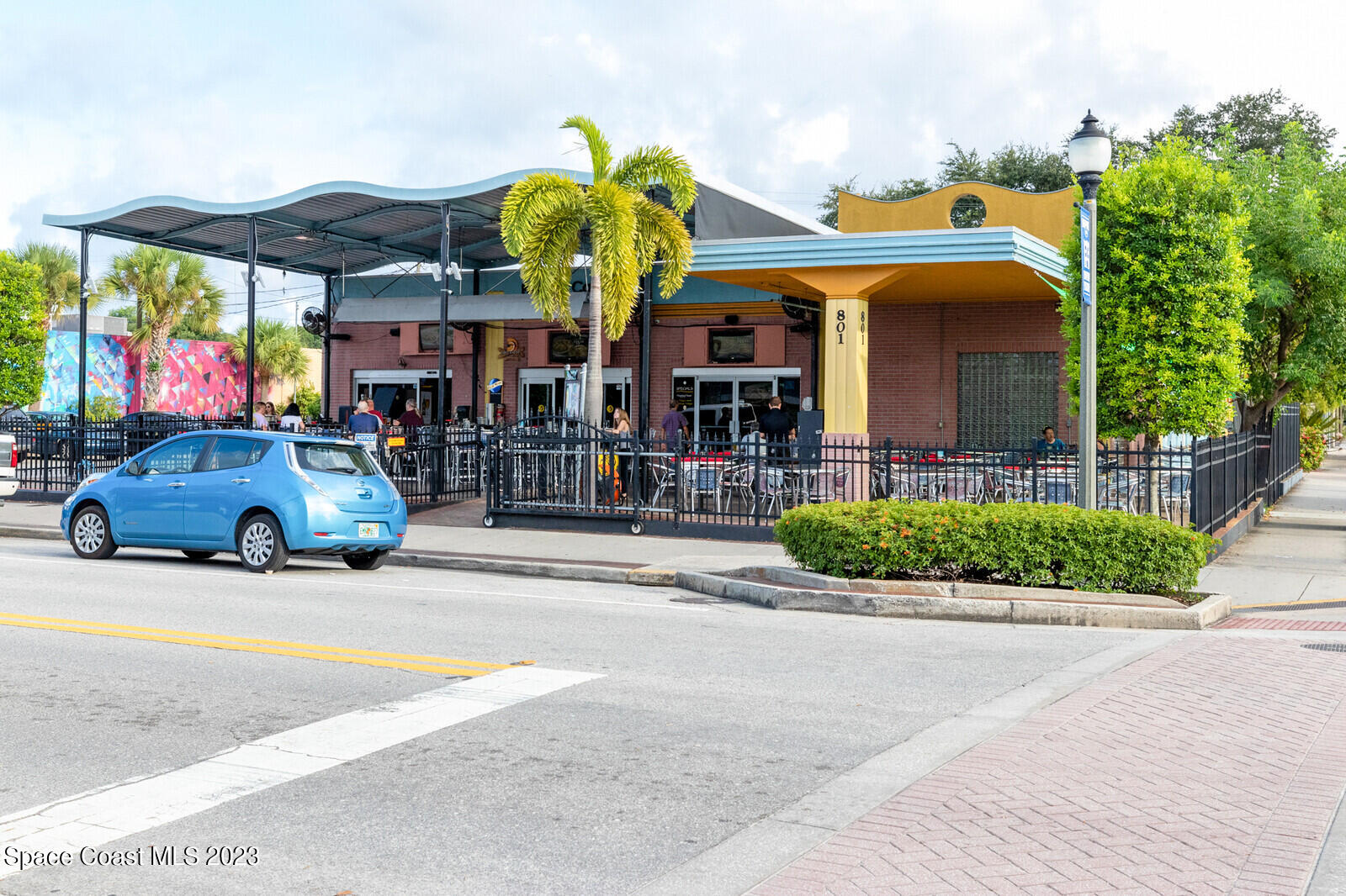 1041 South Fork Circle Melbourne, FL 32901 - Photo 51 of 62 a view of a building with a lot of cars on the road