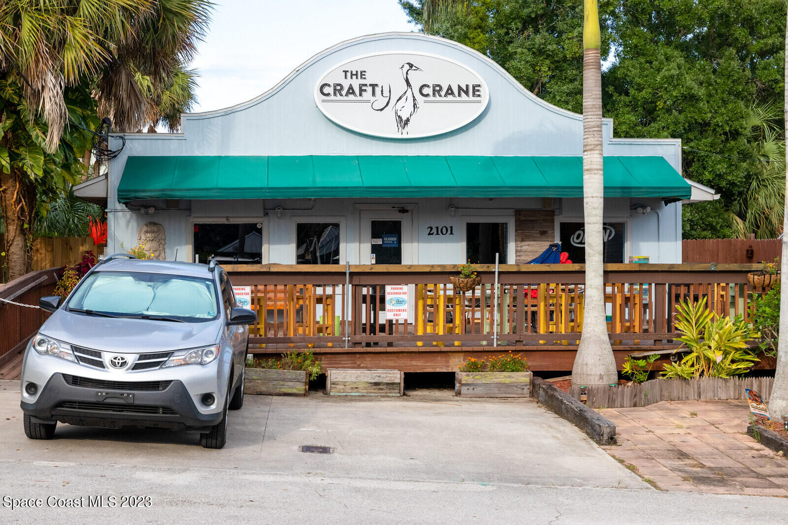 1041 South Fork Circle Melbourne, FL 32901 - Photo 54 of 62 a view of a car park with a car parked in front of it