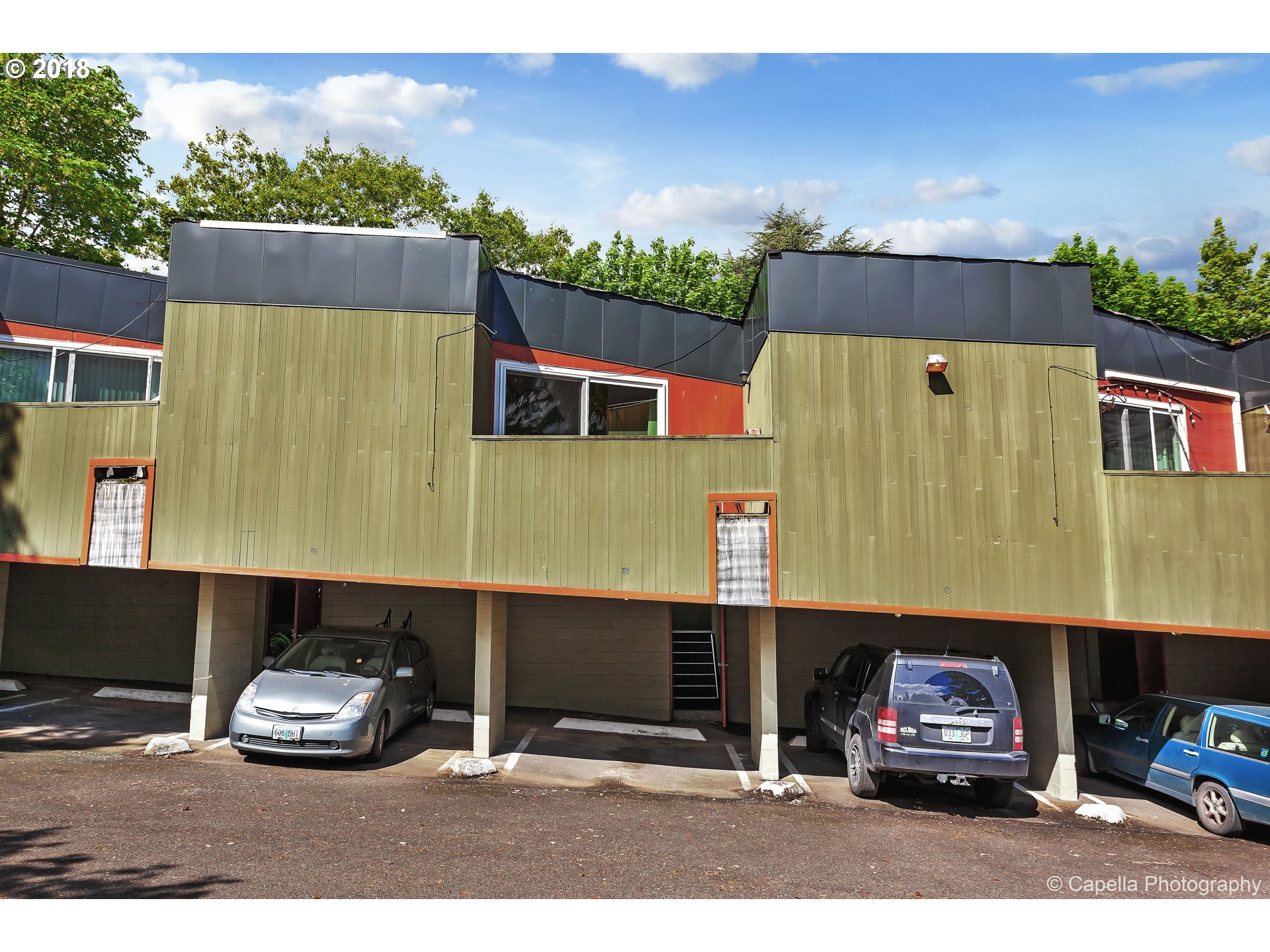 6220 Southwest Capitol Highway, Unit 8 Portland, OR 97239 - Photo 1 of 13 a car parked in front of a building
