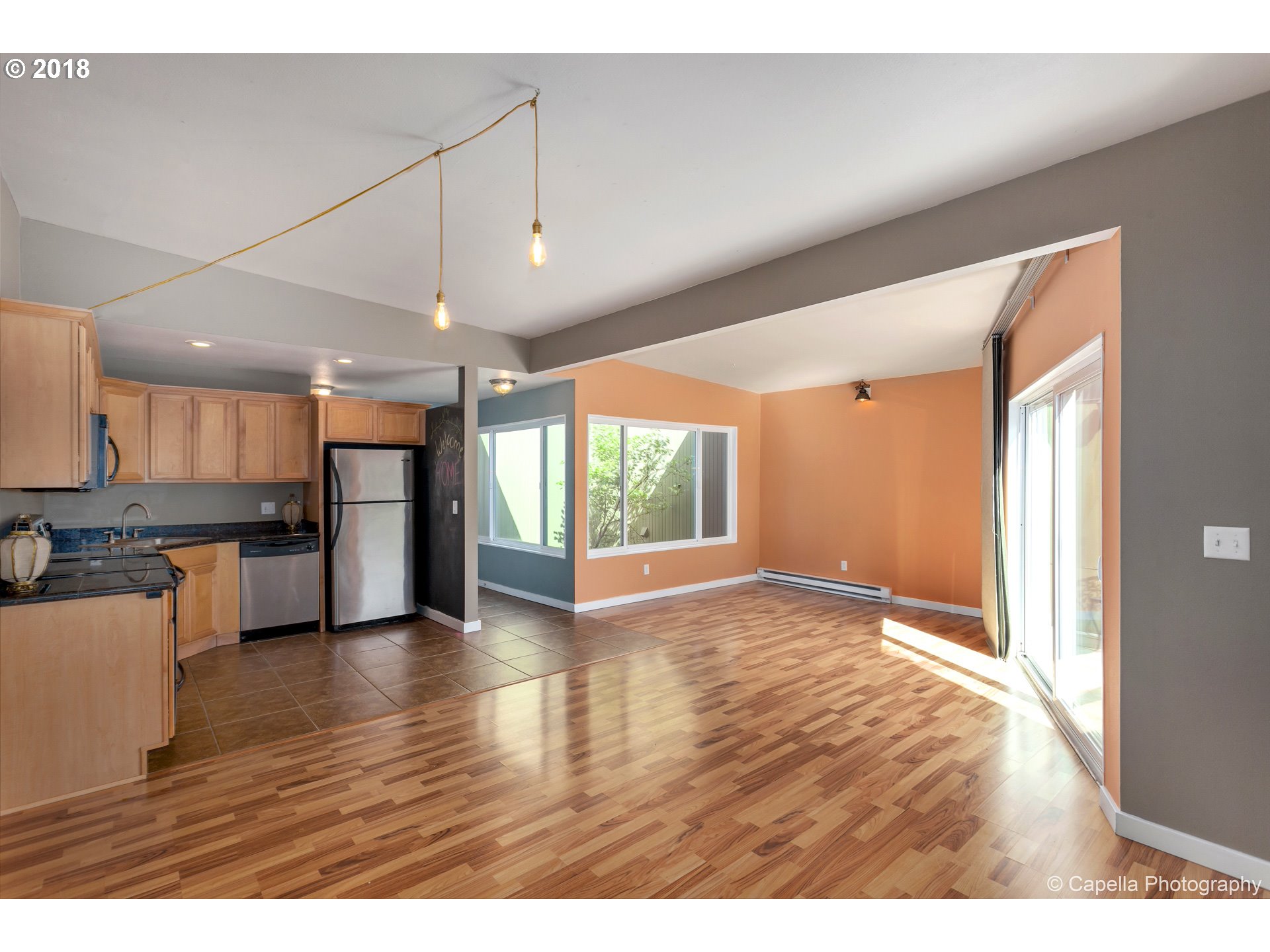 6220 Southwest Capitol Highway, Unit 8 Portland, OR 97239 - Photo 8 of 13 a view of an empty room with kitchen appliances and furniture