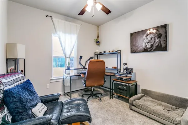 a workspace with furniture and a window