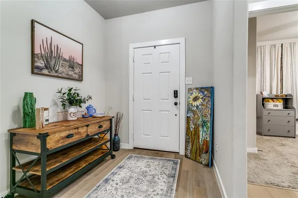 a room with wooden floor and furniture