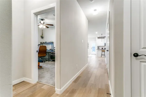 a view of a room and a livingroom with wooden floor