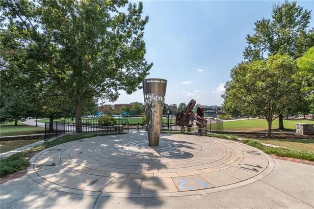 a park view with a bench and trees