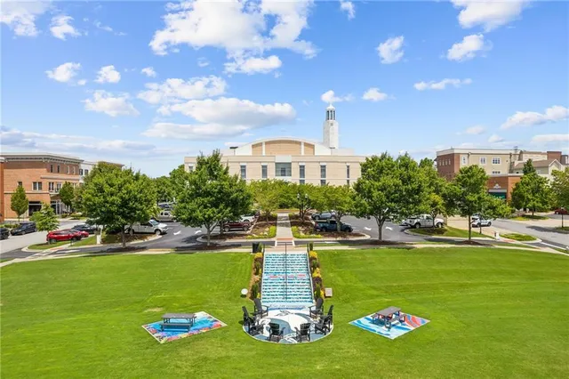 a front view of a house with swimming pool outdoor seating and yard