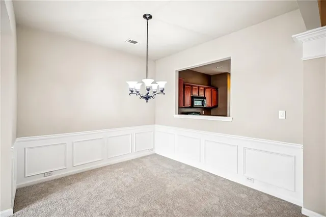 a kitchen with stainless steel appliances granite countertop a stove sink and microwave