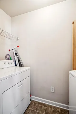 an aerial view of a chairs and table on the patio