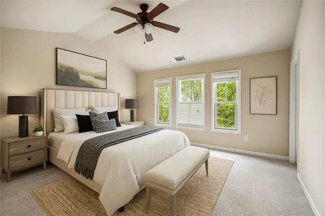 a spacious bedroom with a large bed and a window