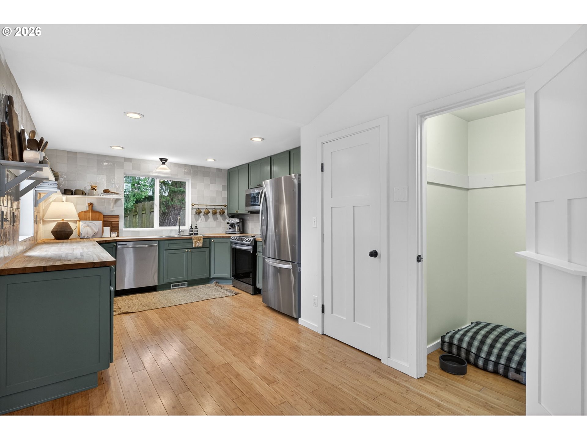 9843 Southwest 2nd Avenue Portland, OR 97219 - Photo 16 of 38 a kitchen with a refrigerator and a sink