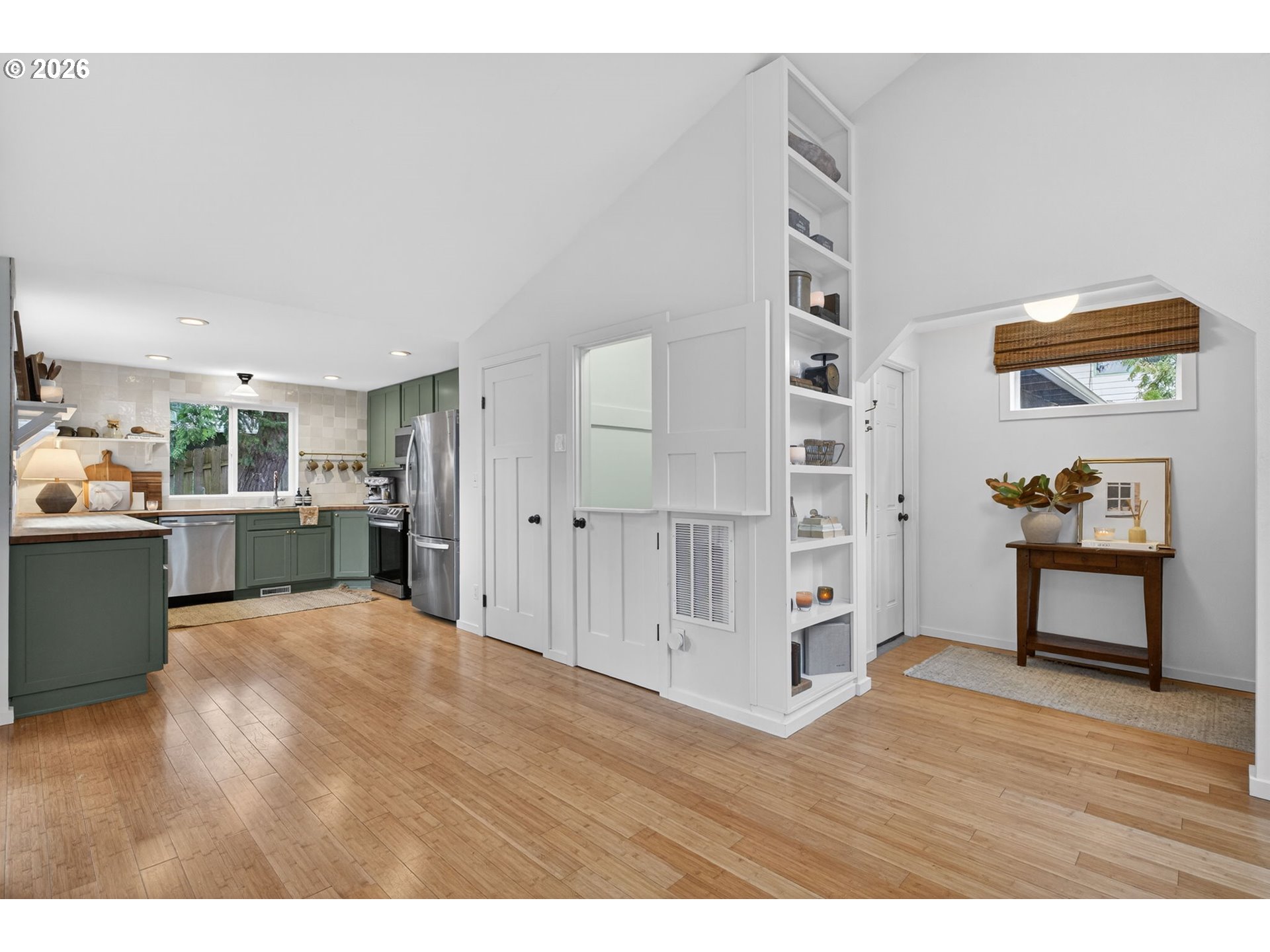 9843 Southwest 2nd Avenue Portland, OR 97219 - Photo 17 of 38 a view of a kitchen with wooden floor and a living room