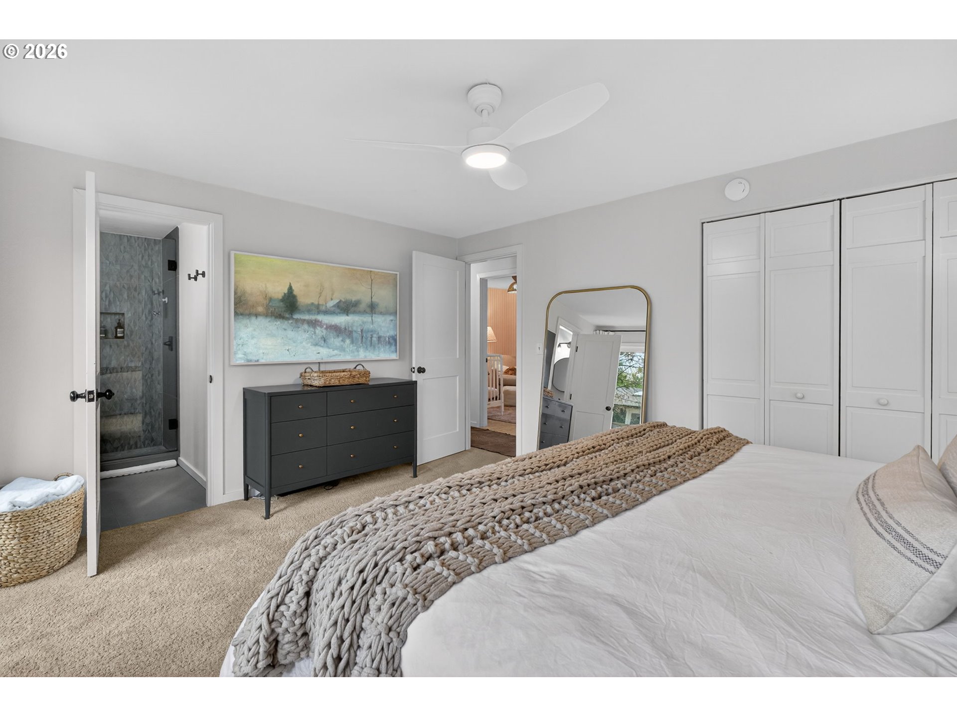 9843 Southwest 2nd Avenue Portland, OR 97219 - Photo 19 of 38 a bedroom with a bed and a dresser