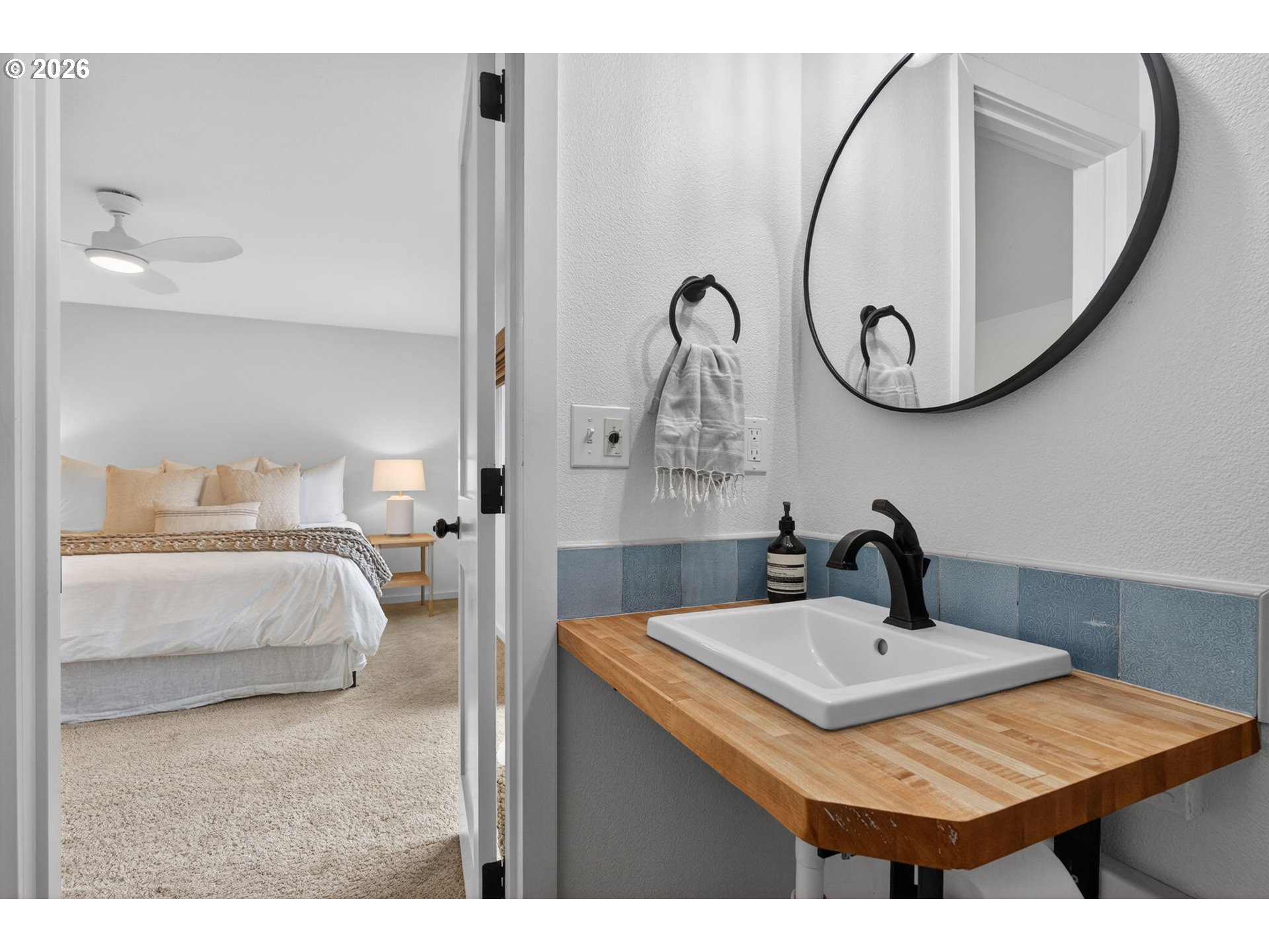9843 Southwest 2nd Avenue Portland, OR 97219 - Photo 22 of 38 a bathroom with a sink and a mirror