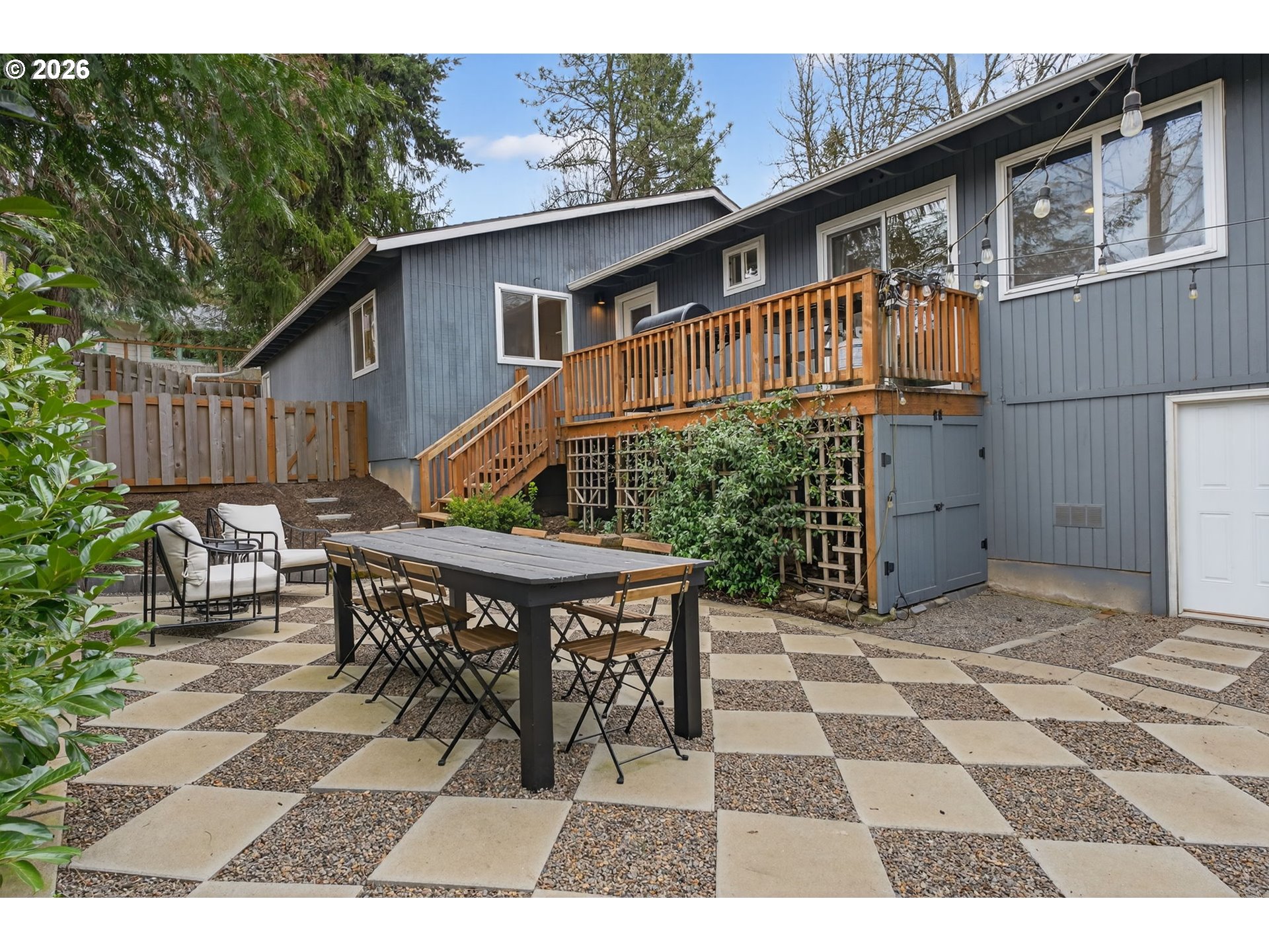 9843 Southwest 2nd Avenue Portland, OR 97219 - Photo 34 of 38 a backyard of a house with table and chairs