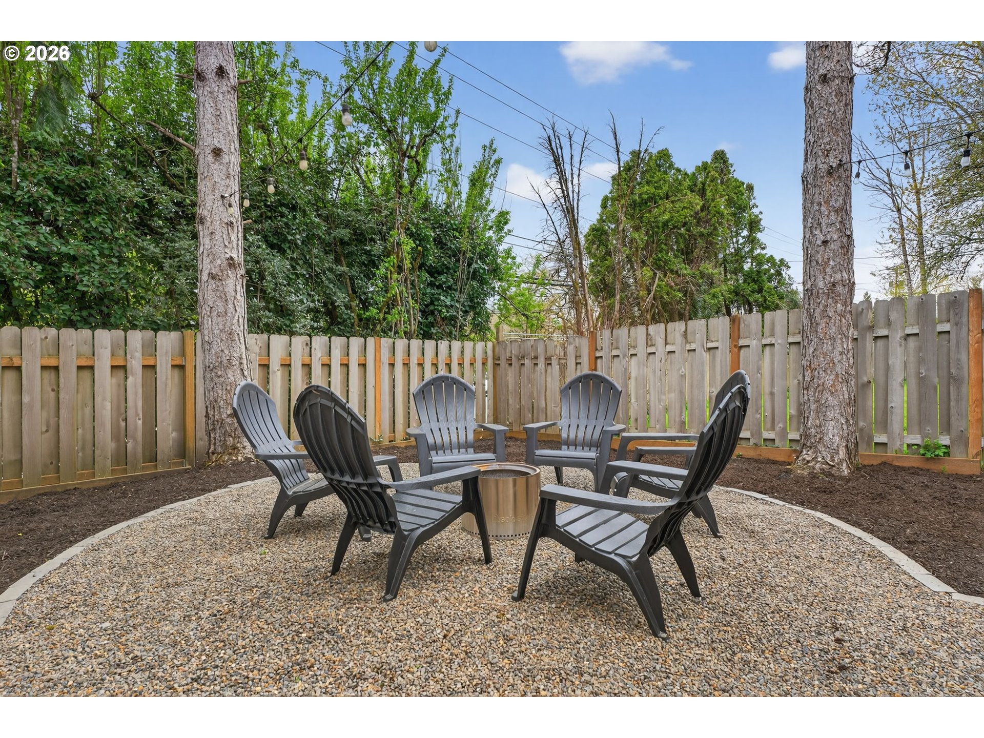 9843 Southwest 2nd Avenue Portland, OR 97219 - Photo 36 of 38 a view of a backyard with furniture and a garden