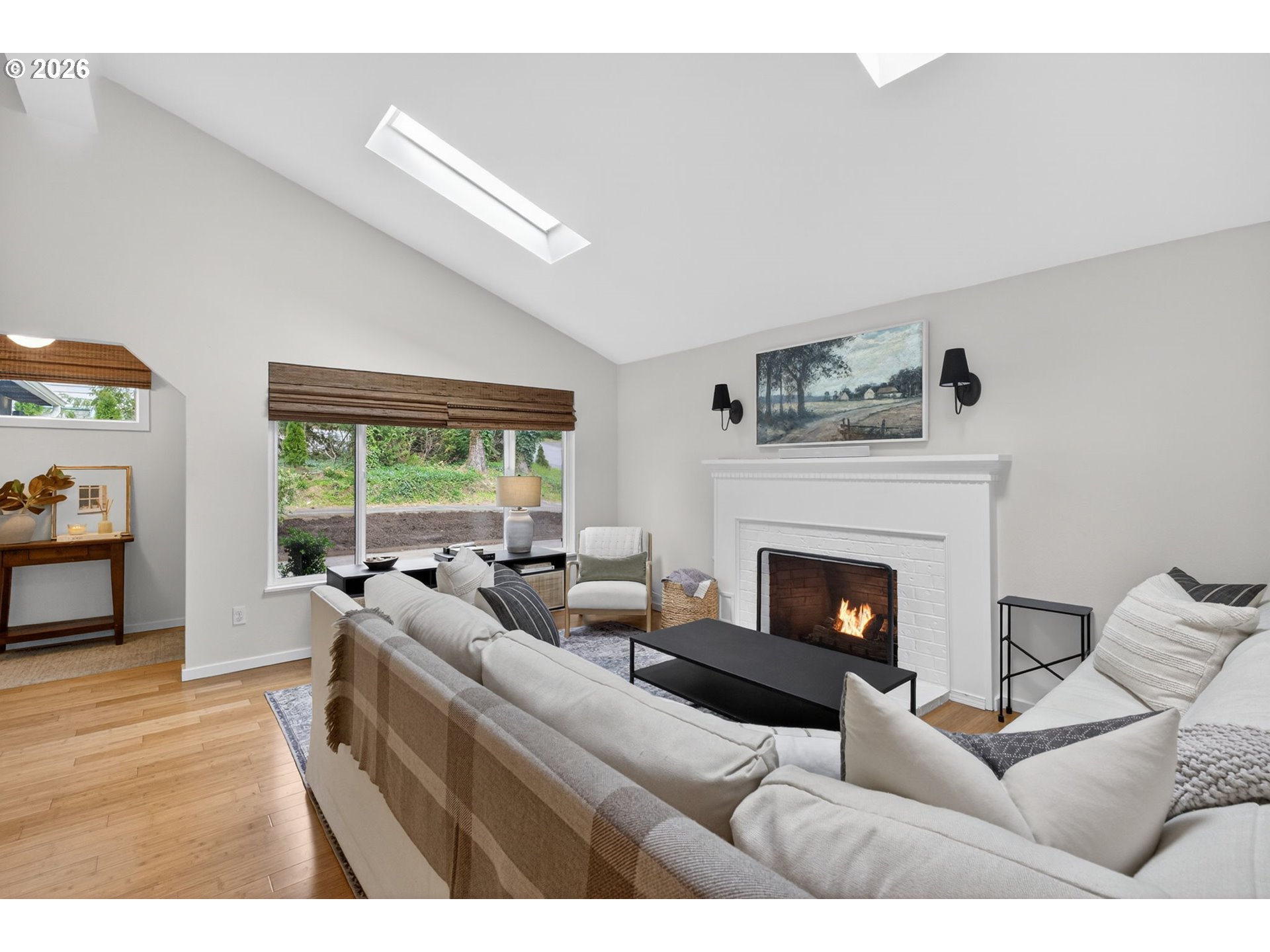 9843 Southwest 2nd Avenue Portland, OR 97219 - Photo 6 of 38 a living room with furniture and a fireplace
