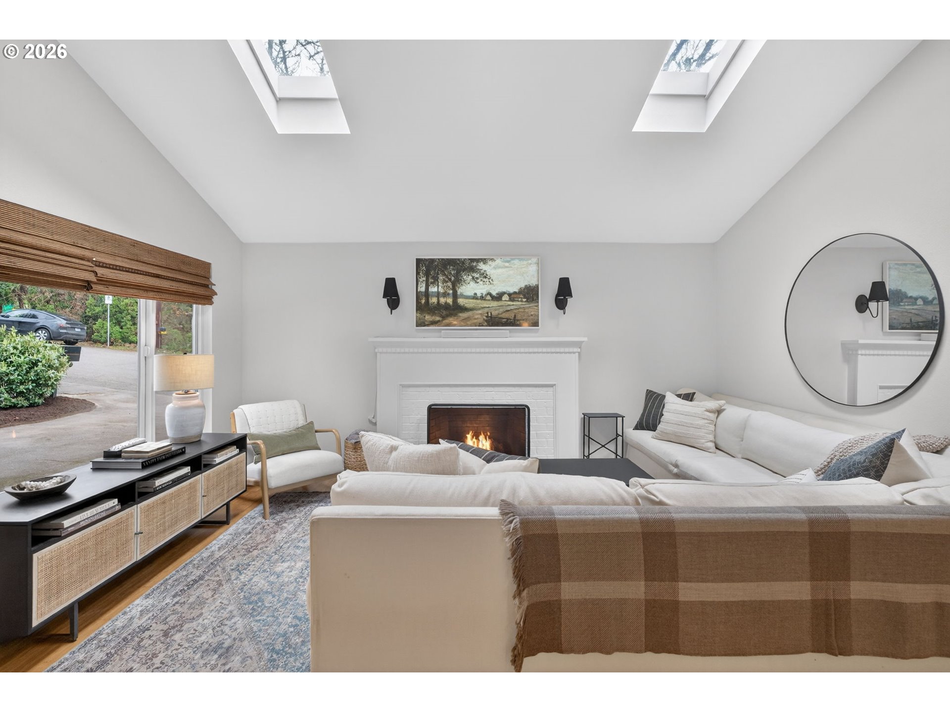 9843 Southwest 2nd Avenue Portland, OR 97219 - Photo 7 of 38 a living room with furniture a large window and a fireplace
