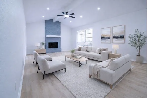 a living room with furniture and a fireplace