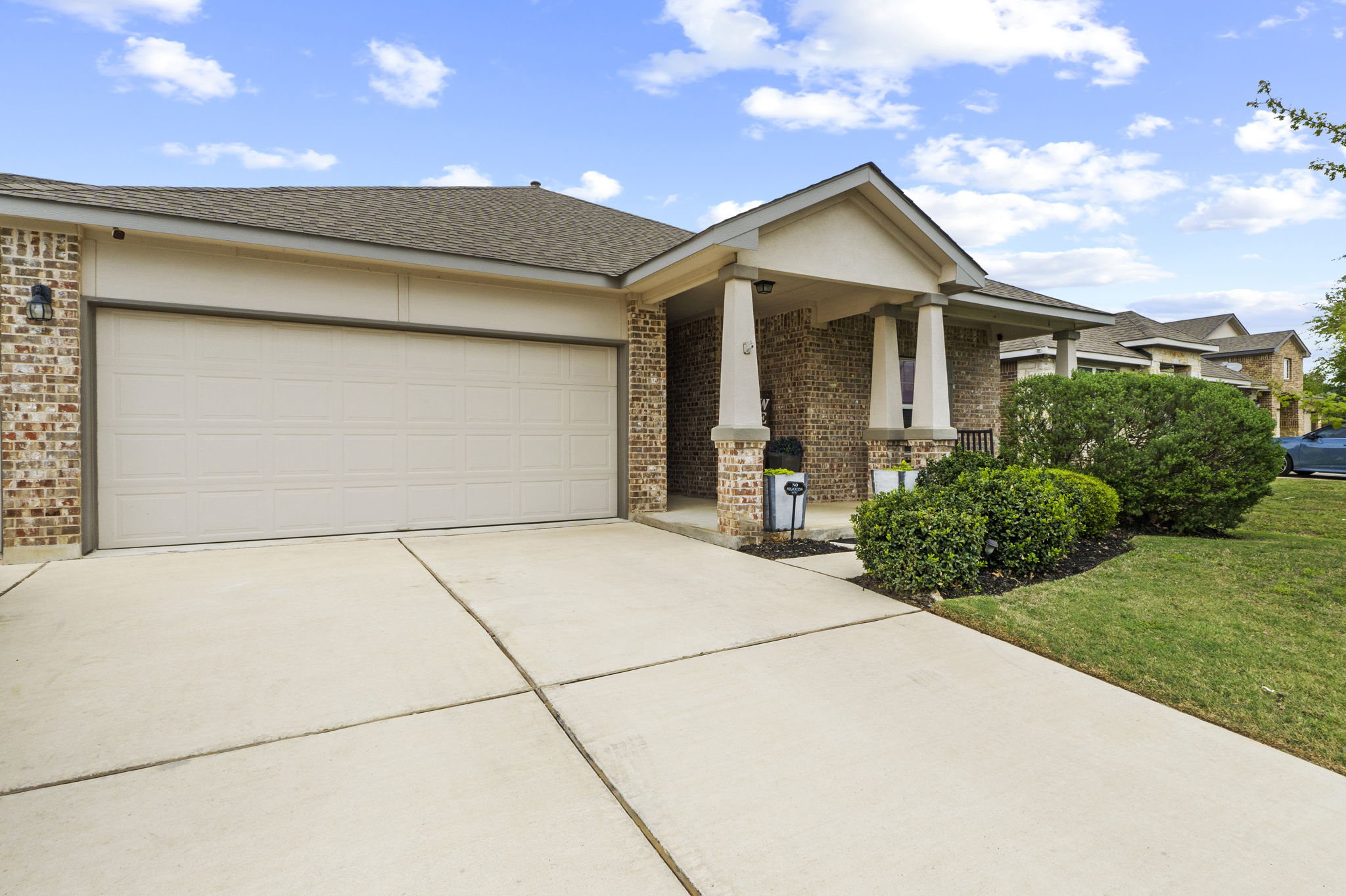 2417 Bridges Ranch Road Georgetown, TX 78628 - Photo 18 of 36 Craftsman inspired home with brick siding, driveway, an attached garage, and roof with shingles