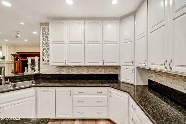 a view of a room with shelves on the wall