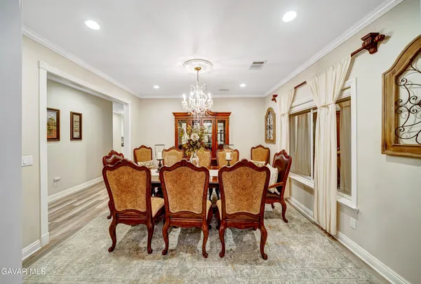 a kitchen with stainless steel appliances kitchen island granite countertop a refrigerator and a stove top oven
