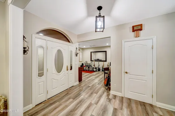 a kitchen with sink stove and cabinets