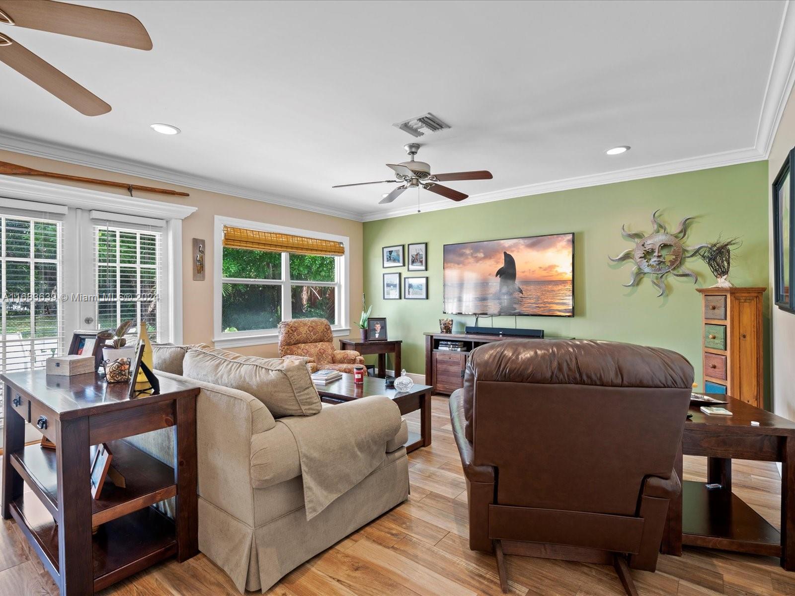 368 Church Road Tequesta, FL 33469 - Photo 9 of 20 a living room with furniture and a flat screen tv