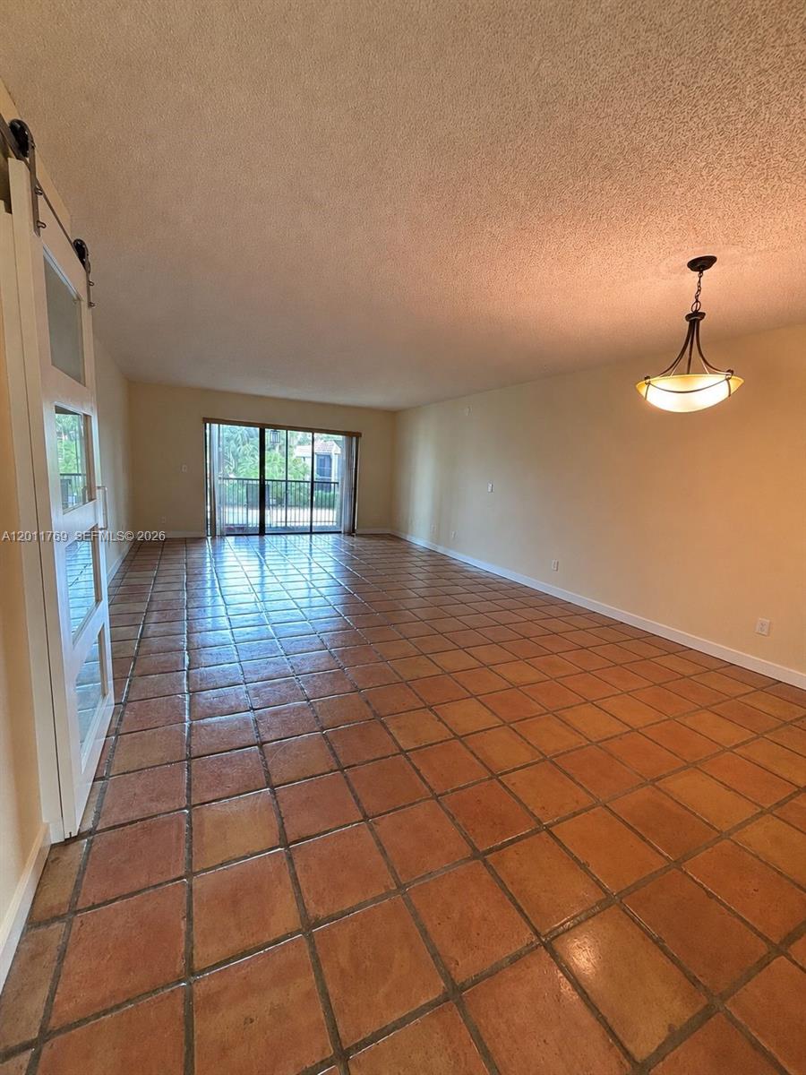 286 Racquet Club Road, Unit 204 Weston, FL 33326 - Photo 11 of 11 a view of an empty room and window