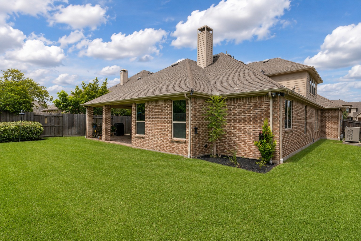 2326 Hamilton Pool Lane Friendswood, TX 77546 - Photo 42 of 49 a front view of a house with garden