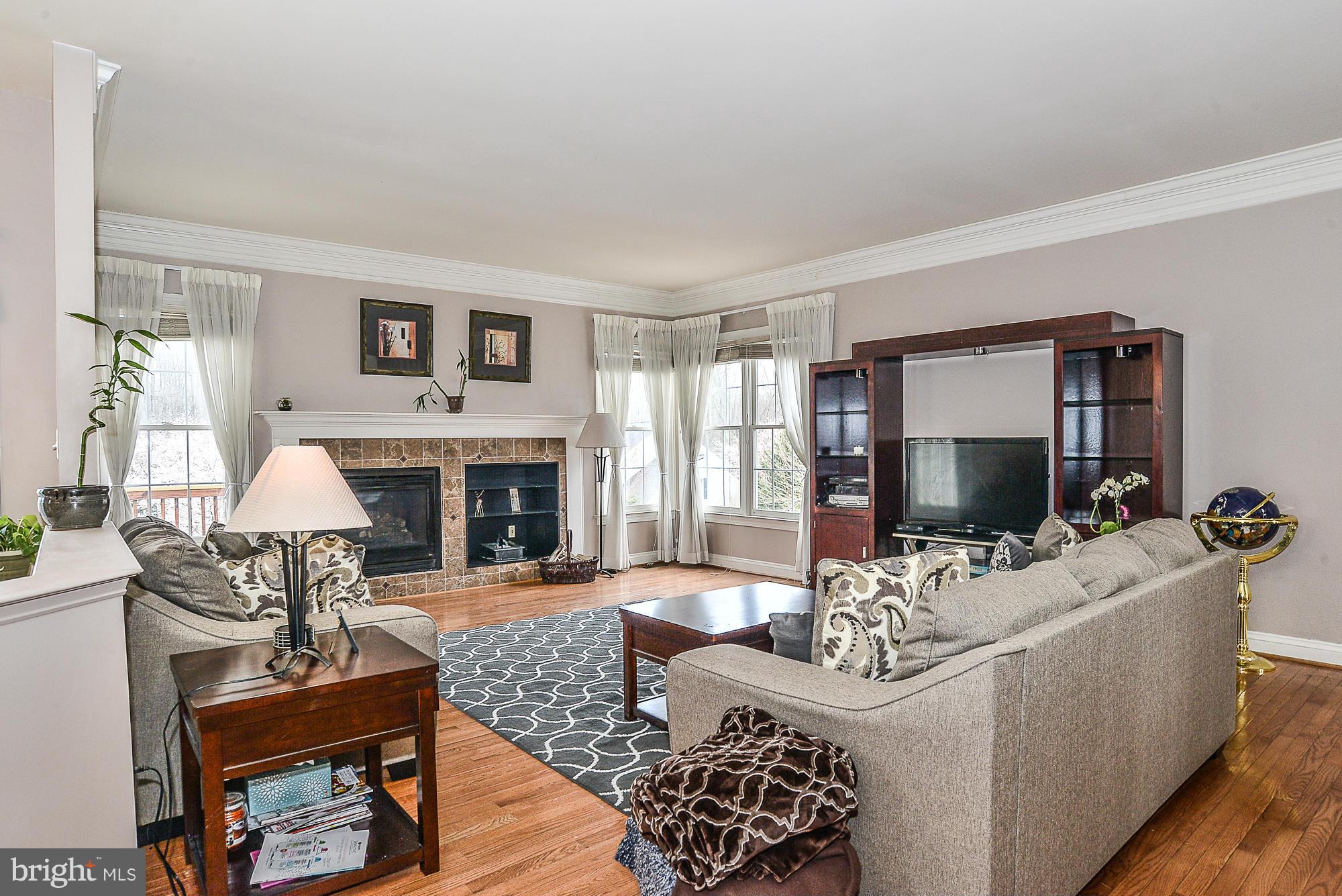 8747 Center Road Springfield, VA 22152 - Photo 14 of 30 a living room with furniture fireplace and window