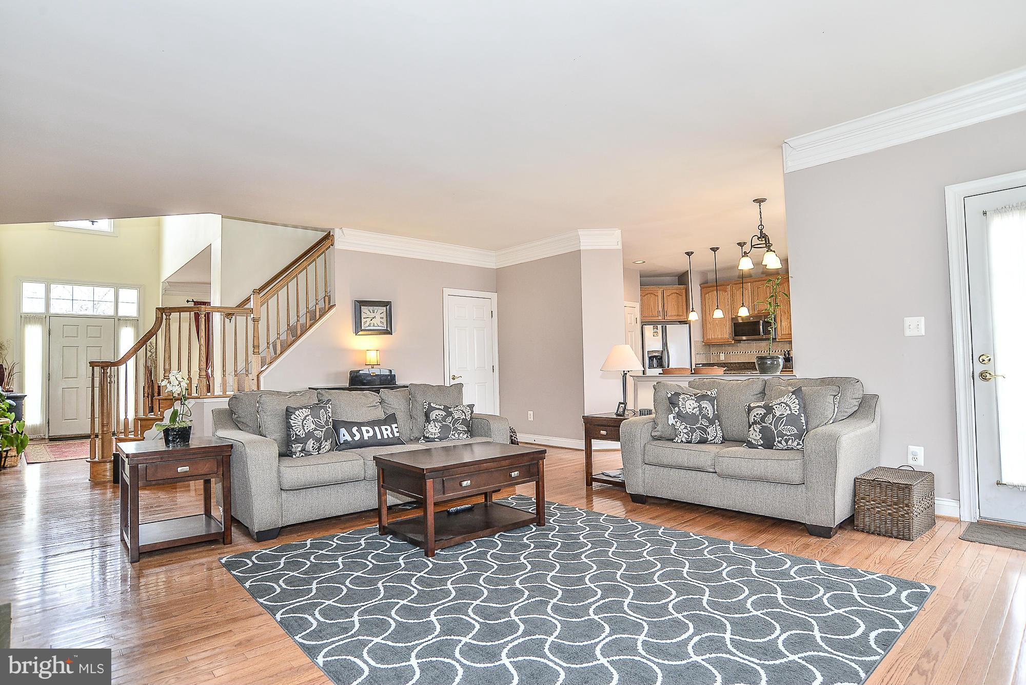 8747 Center Road Springfield, VA 22152 - Photo 30 of 30 a living room with furniture and wooden floor