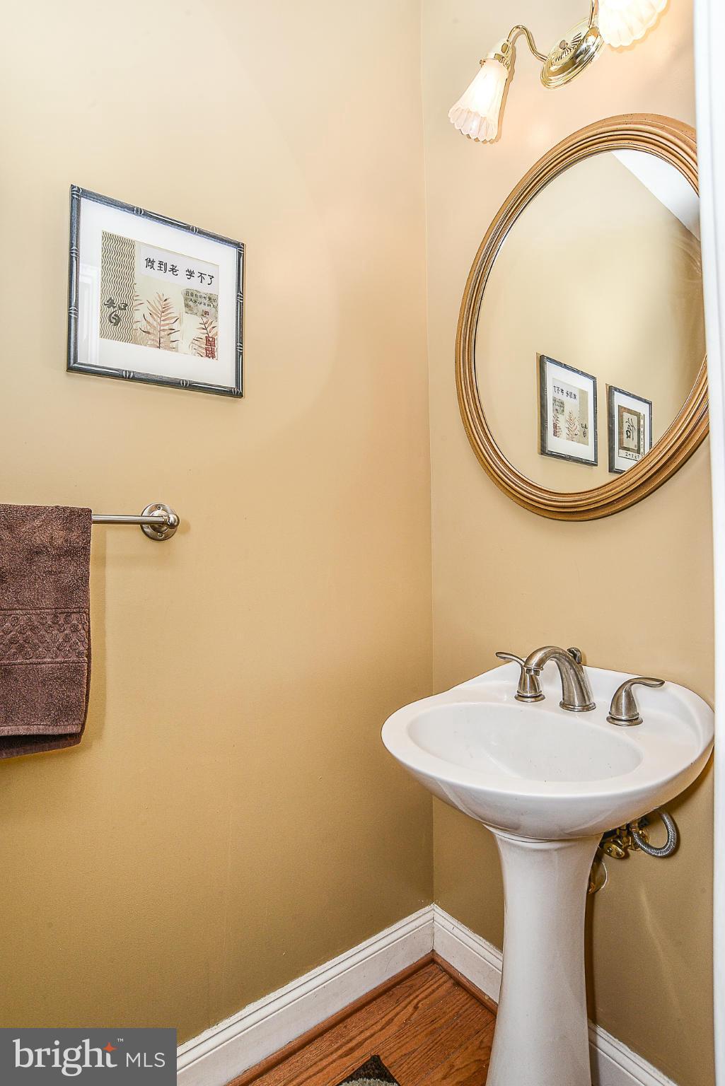8747 Center Road Springfield, VA 22152 - Photo 17 of 30 a bathroom with a sink and a mirror