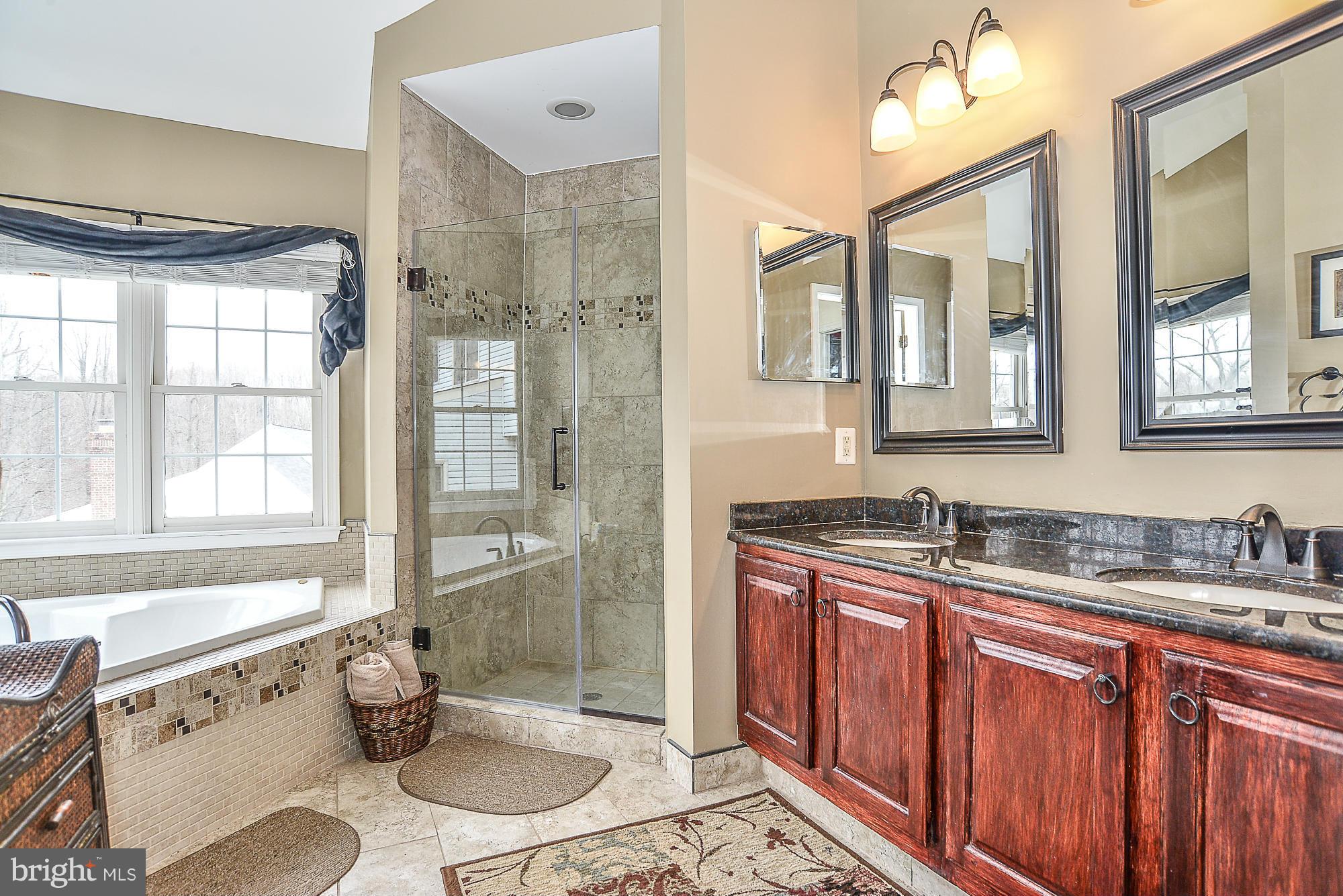 8747 Center Road Springfield, VA 22152 - Photo 20 of 30 a bathroom with a granite countertop sink toilet mirror and shower