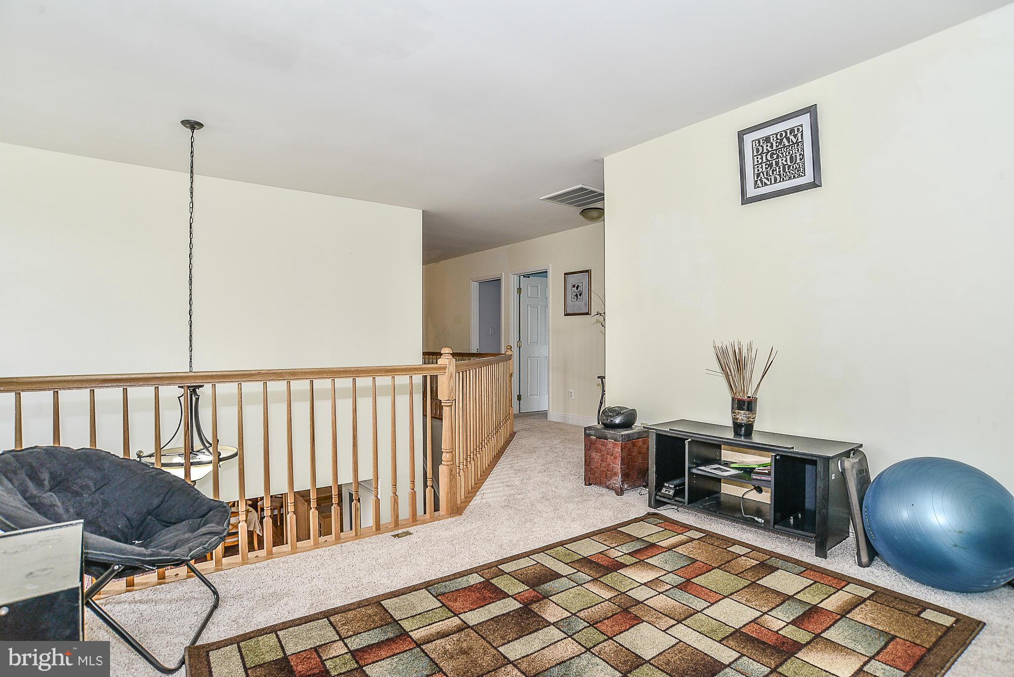 8747 Center Road Springfield, VA 22152 - Photo 23 of 30 a living room with furniture and a wooden floor