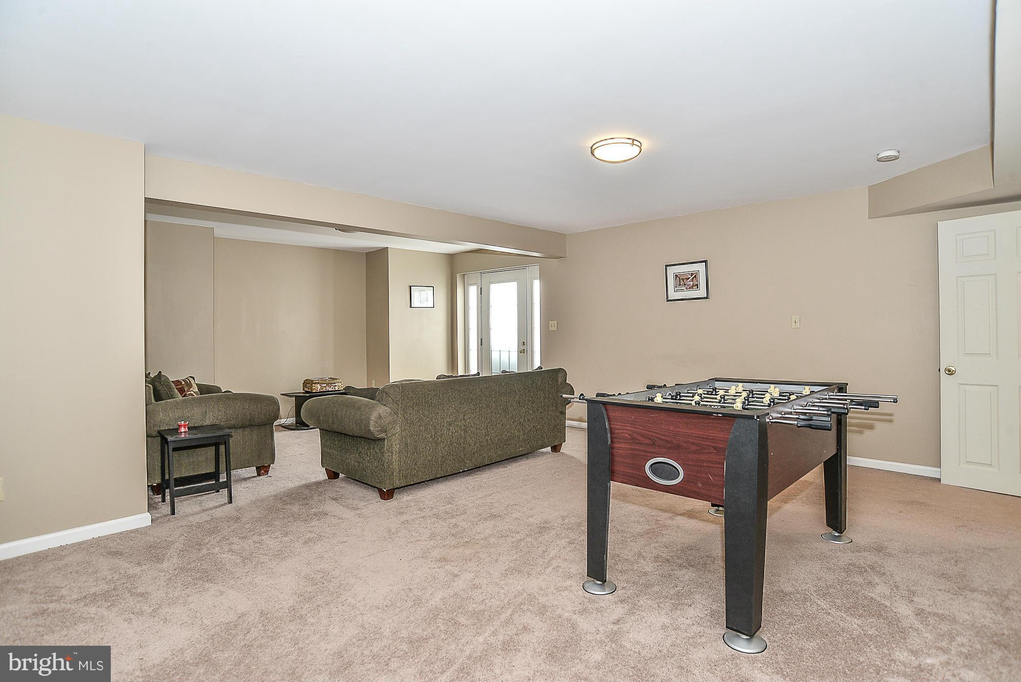 8747 Center Road Springfield, VA 22152 - Photo 25 of 30 a living room with furniture and a window