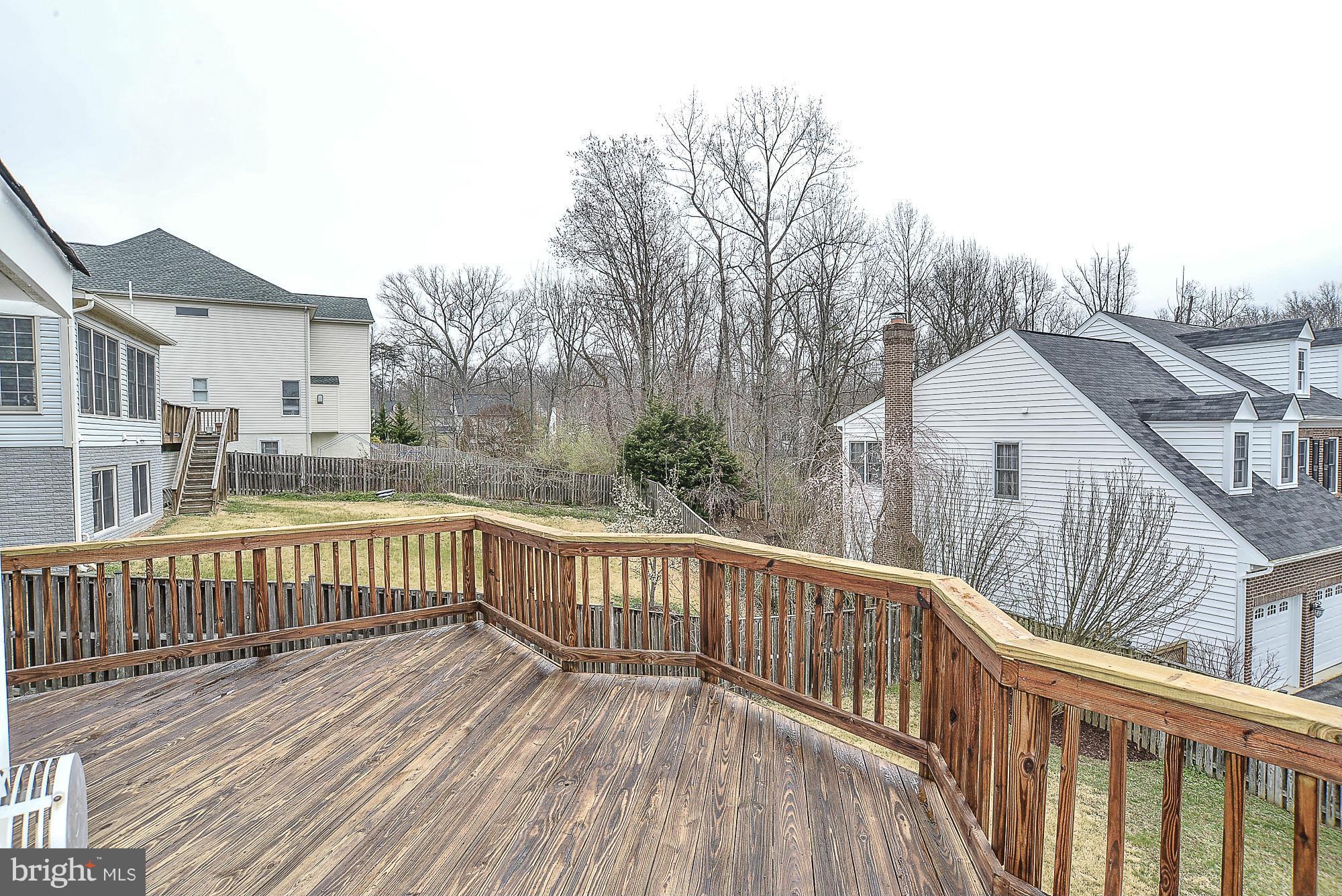 8747 Center Road Springfield, VA 22152 - Photo 27 of 30 a view of a wooden roof deck