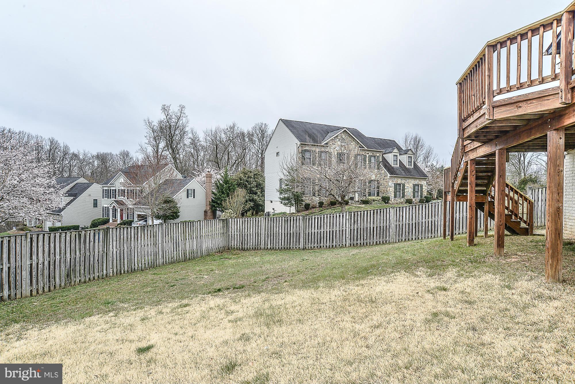 8747 Center Road Springfield, VA 22152 - Photo 28 of 30 a view of a backyard with a fence
