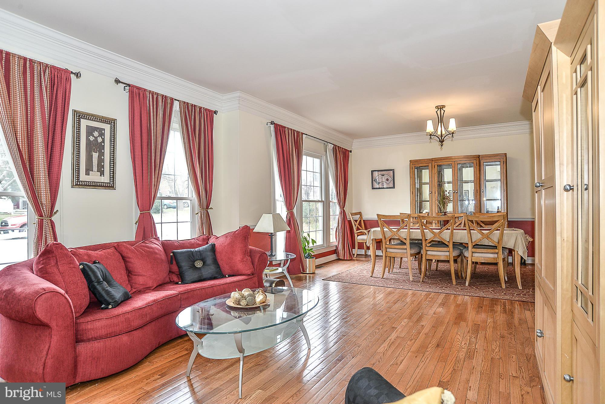 8747 Center Road Springfield, VA 22152 - Photo 5 of 30 a living room with furniture and a large window