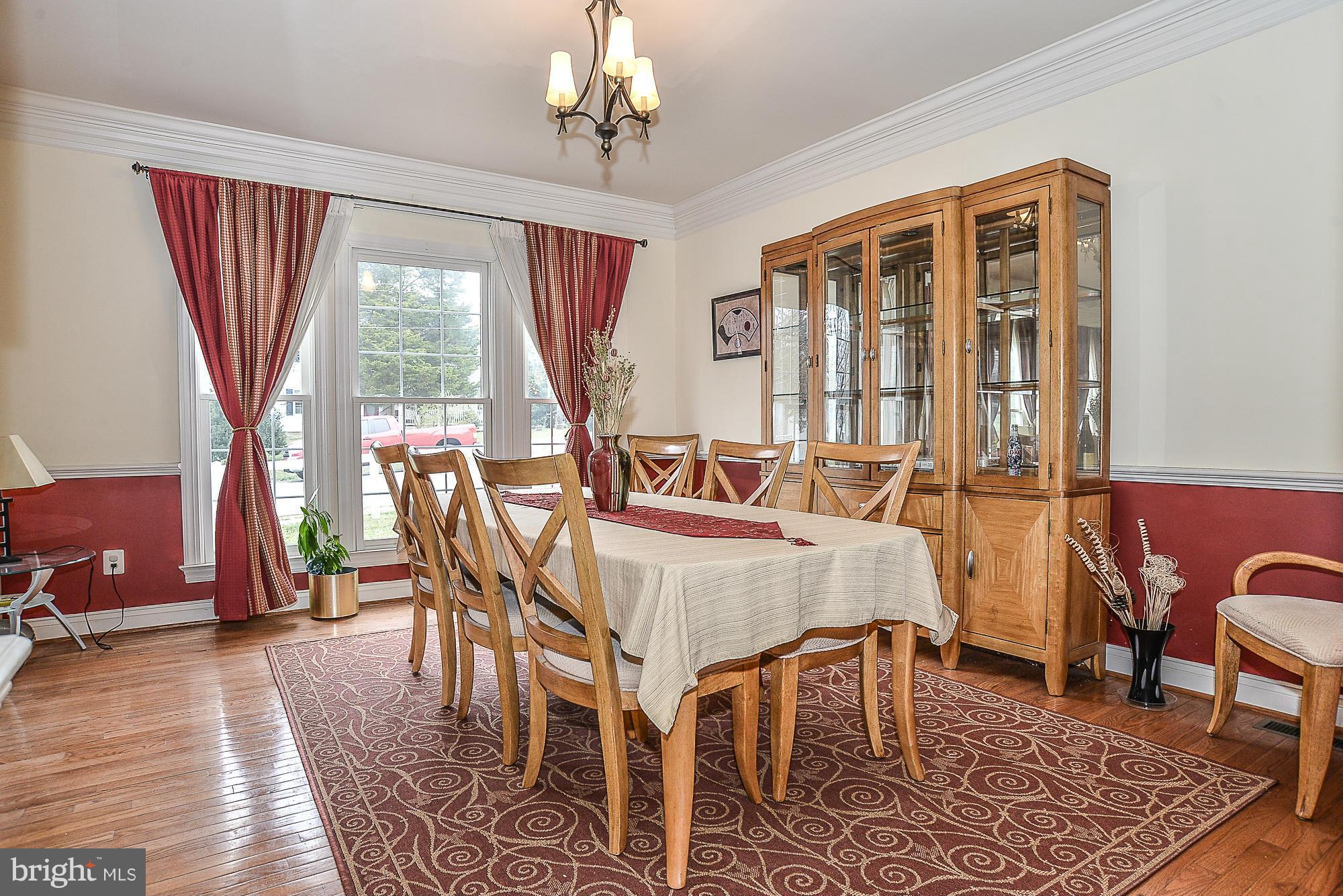 8747 Center Road Springfield, VA 22152 - Photo 7 of 30 a view of a dining room with furniture window and outside view