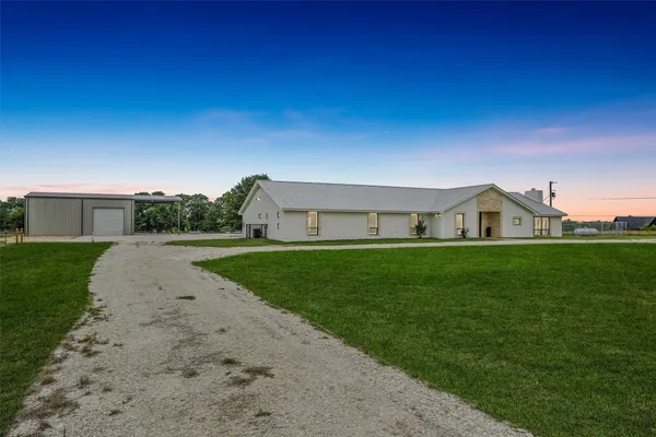a view of house in front of house with yard