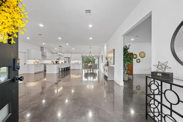 a lobby with furniture and a potted plant