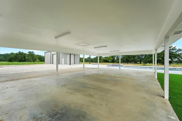 a view of house with a backyard