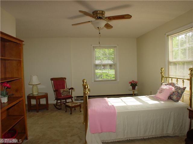 106 Applegate Road Kernersville, NC 27284 - Photo 12 of 16 4th Bedroom. Originally added on as a bedroom for Mom, this room would also make an excellent new master bedroom featuring private bath and walk-in closet.