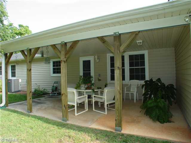 106 Applegate Road Kernersville, NC 27284 - Photo 15 of 16 Exterior Back. Covered Back Porch for morning coffee, fun back yard barbeques or just relaxing in the cool of the day.