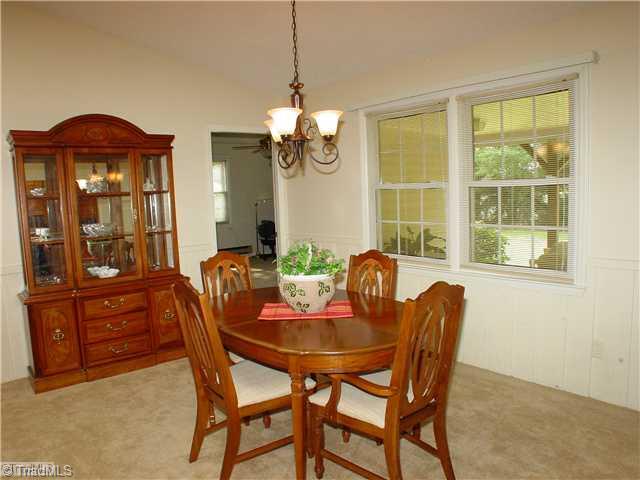Dining Room. Entertain an continue to gather at the table while others relax in the same area on the sofa.