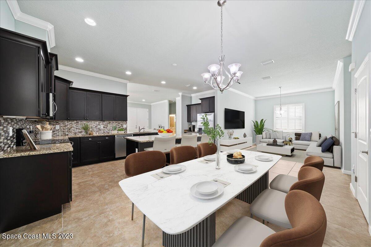 603 Heming Way Melbourne, FL 32901 - Photo 18 of 45 a large kitchen with a table and chairs
